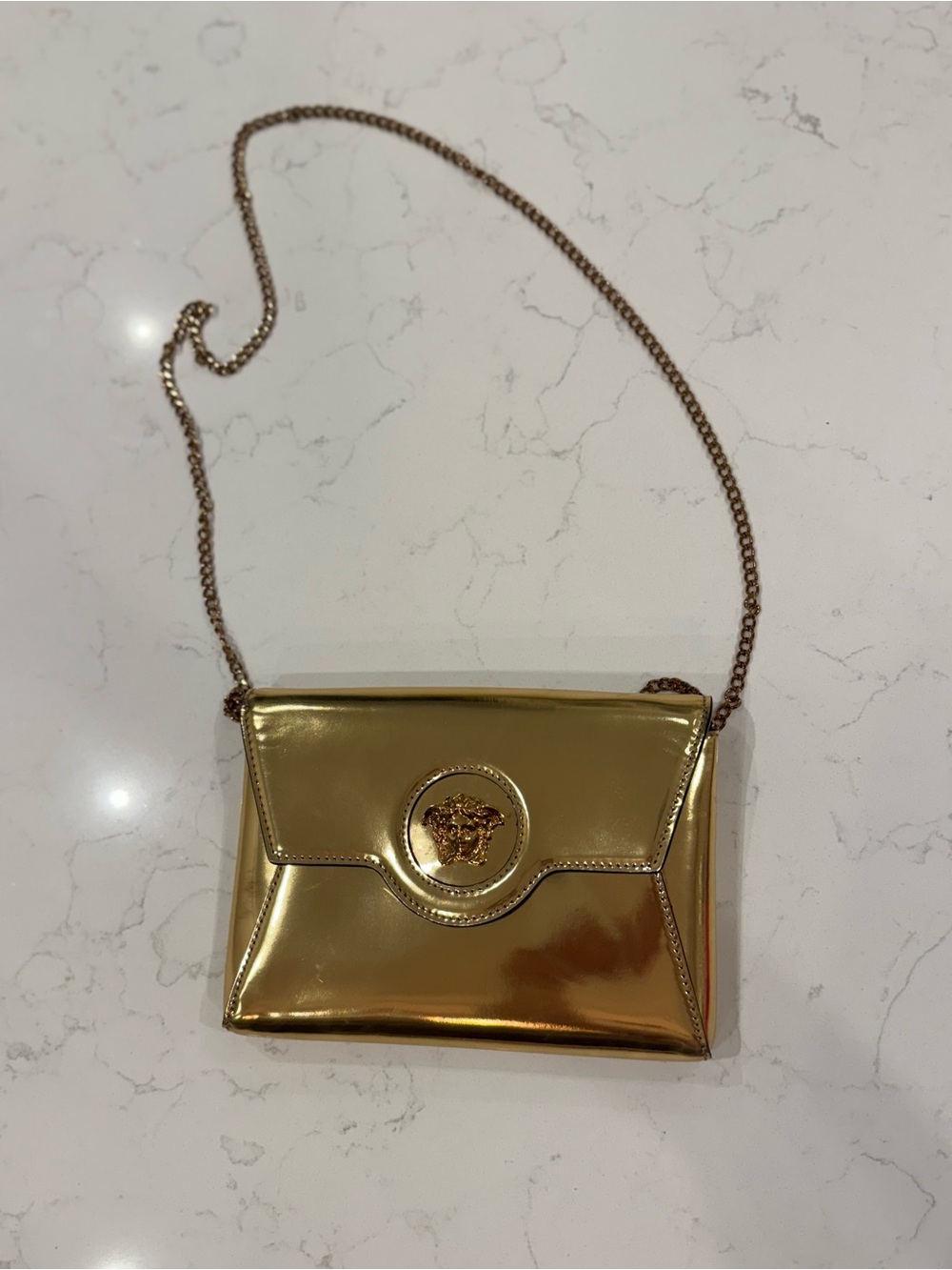 Versace Metallic Gold Medallion Chain Crossbody Bag. One scratch on the back.